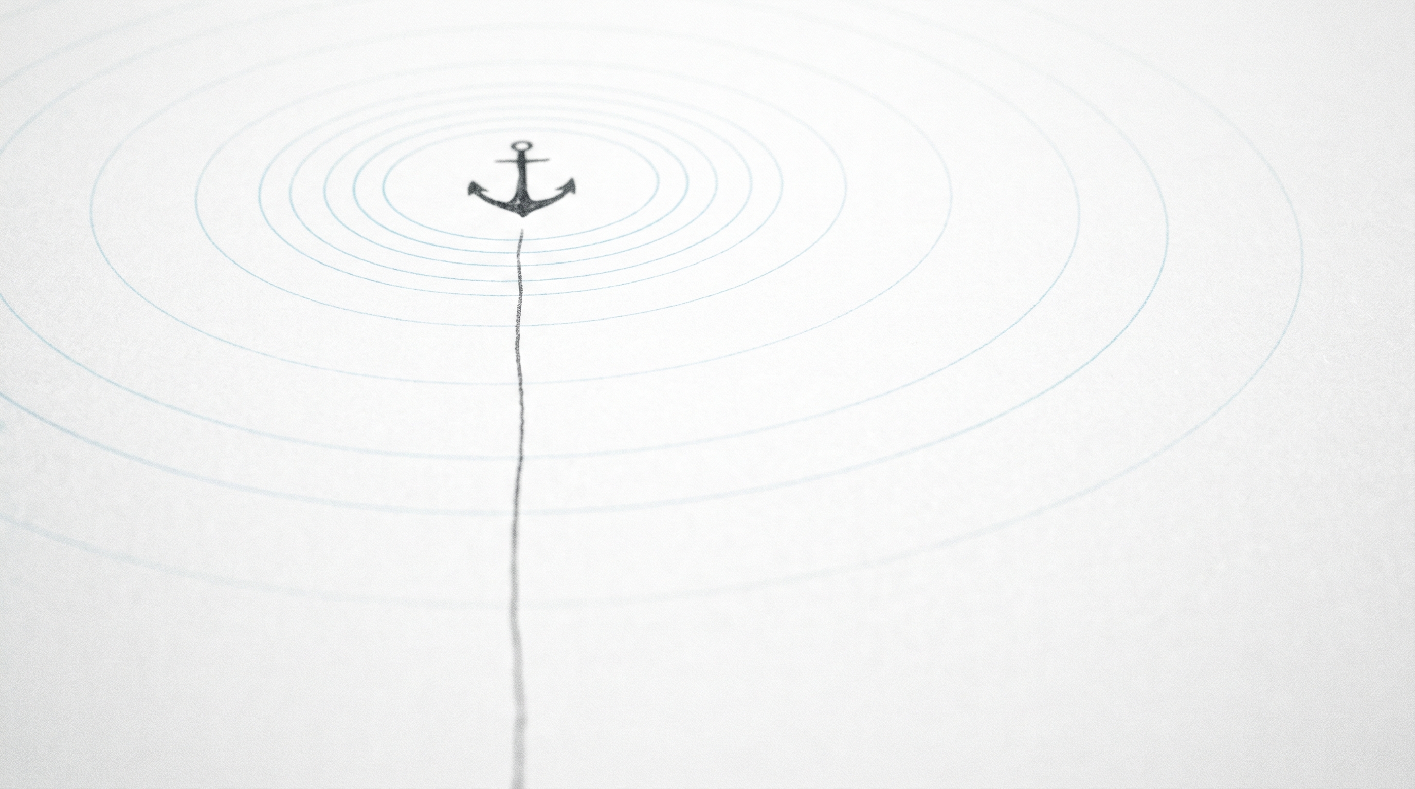 A graphite line descending to an anchor point on porcelain white, thin cyan rings radiating outward like a timestamp